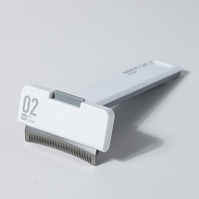 Deshedding comb removing undercoat fur from dog