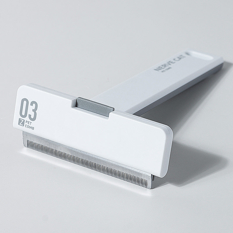 Deshedding comb being used on cat coat
